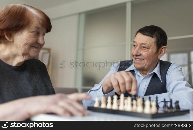 close up woman man playing chess