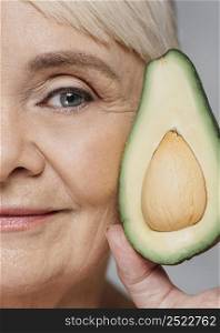 close up woman posing with avocado