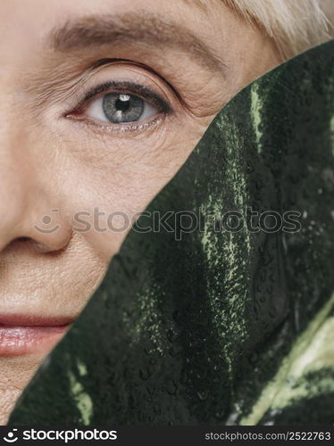 close up woman posing with leaf