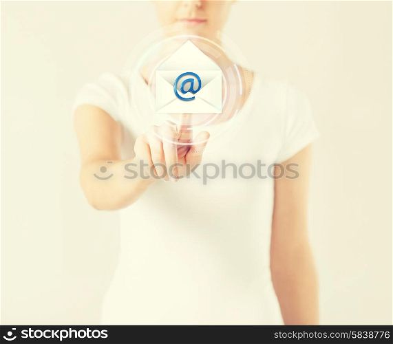 close up woman pressing virtual button with e-mail icon