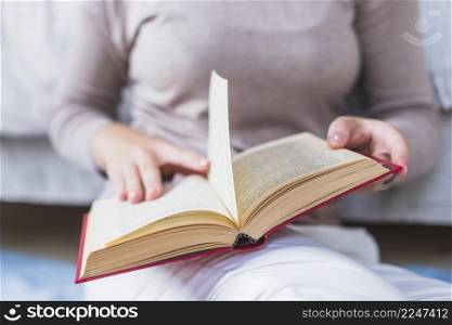 close up woman reading book