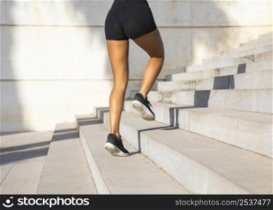 close up woman running stairs