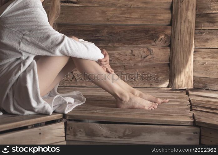 close up woman s feet wooden bench sauna
