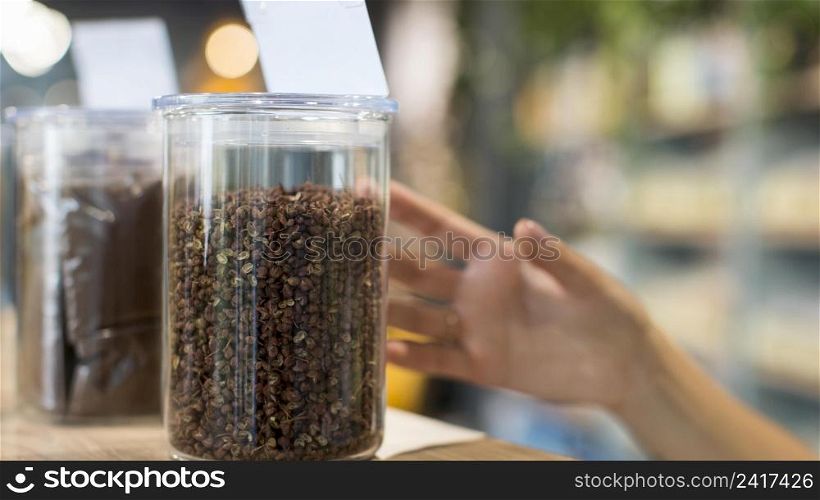 close up woman shopping organic spices