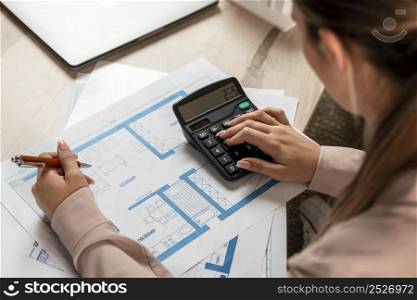 close up woman using calculator