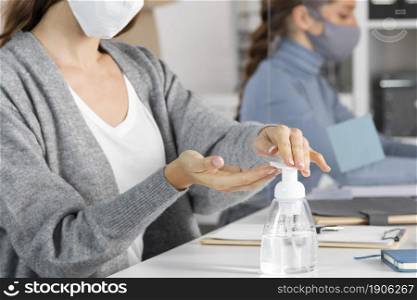 close up woman using disinfectant. High resolution photo. close up woman using disinfectant. High quality photo