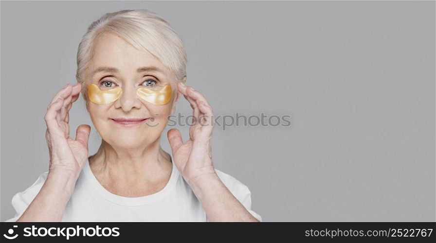 close up woman using eye patches