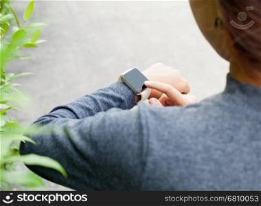 close-up woman using smart watch on hand new modern lifestyle