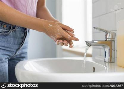 close up woman washing her hands