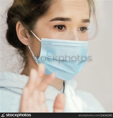 close up woman wearing face mask 2