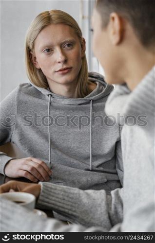 close up women chatting