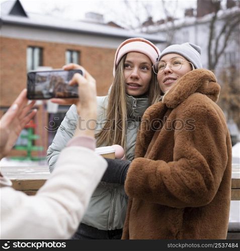close up women posing outside
