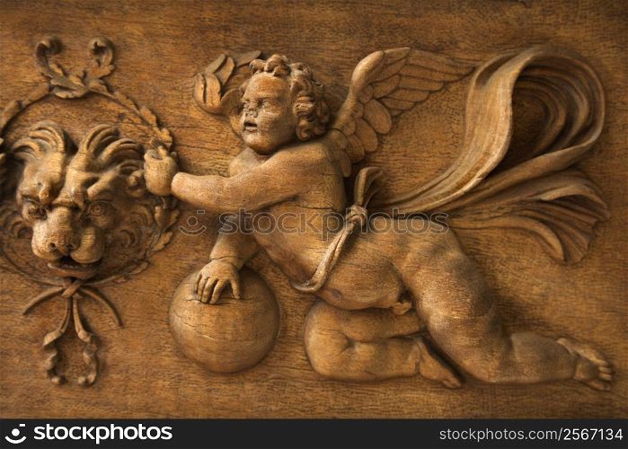 Close-up wood carving of cherub angel in the Vatican Museum, Rome, Italy.
