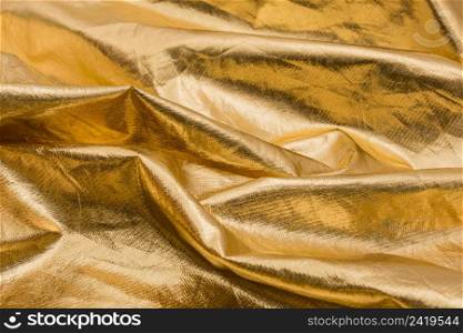 close up wrinkled golden material