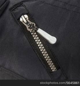 Close up zipper on a black background