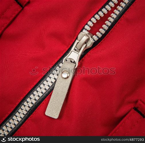 Close up zipper on a red background