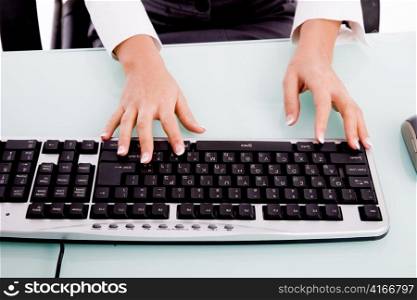 close view of hands operating keyboard on an isolated white background