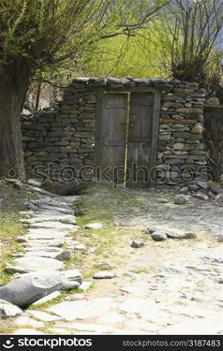Closed door on a stone wall, Annapurna Range, Himalayas, Nepal