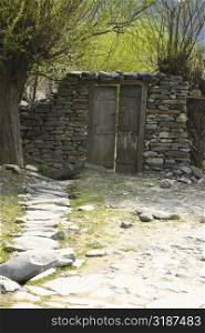 Closed door on a stone wall, Annapurna Range, Himalayas, Nepal