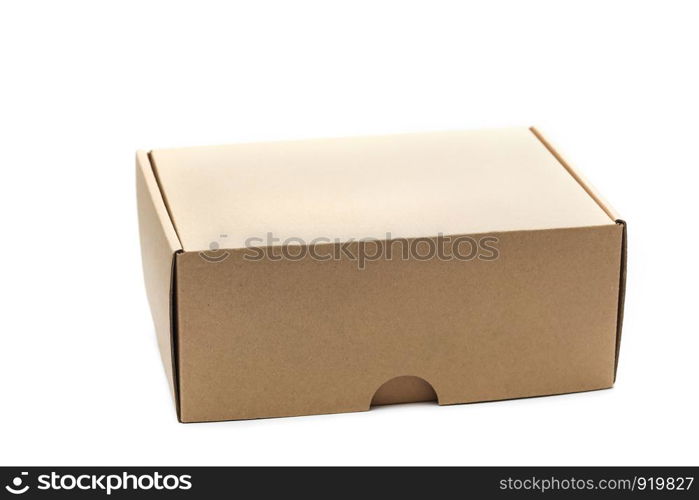 Closed empty cardboard box isolated on a white background, craft boxing. Closed empty cardboard box isolated on a white background