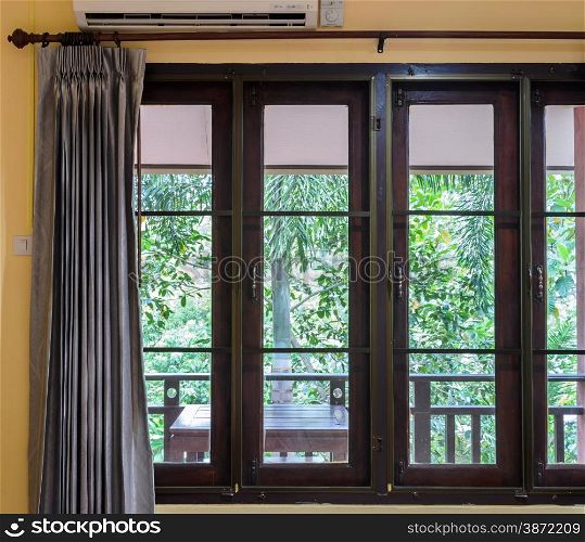 Closed glass window with curtain