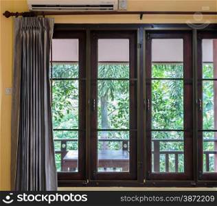 Closed glass window with curtain