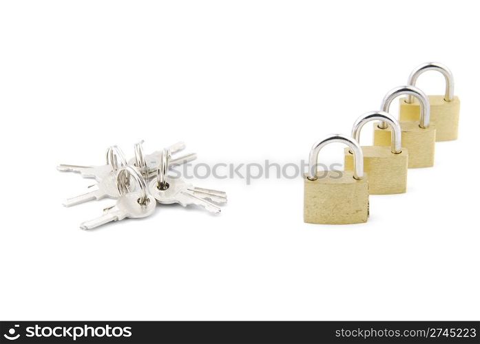 closed golden padlocks with keys isolated on white background
