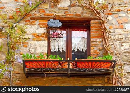 Closed Italian Window Decorated With Fresh Flowers