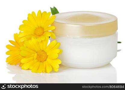 closed jar of cream and marigold flowers on a white background