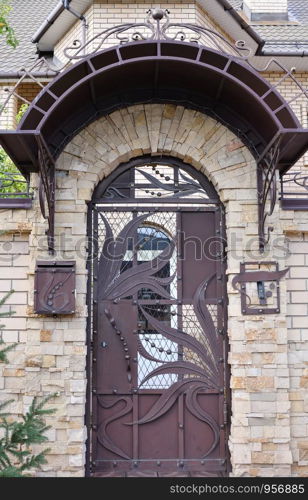 Closed metal door leading to the house