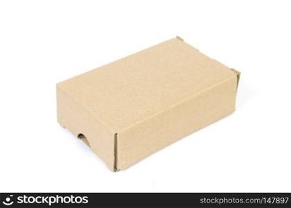 Closed paper box lying on white background