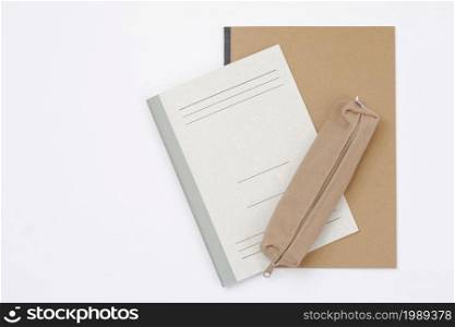 closed pencil case and book