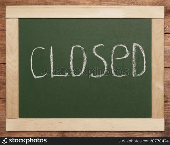 ""closed" written on wooden menu"