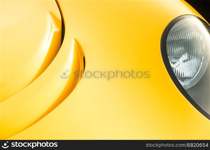 closeup abstract of golden paintwork on a luxury sports-car