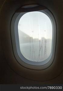 Closeup aircraft&#39;s porthole, window in cabin of airplane