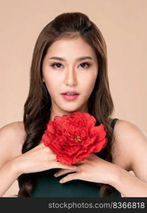 Closeup ardent female model with flawless fair skin and perfect makeup holding flowers. Woman receive flowers, white background.. Closeup ardent female model with fair skin and perfect makeup holding flowers.