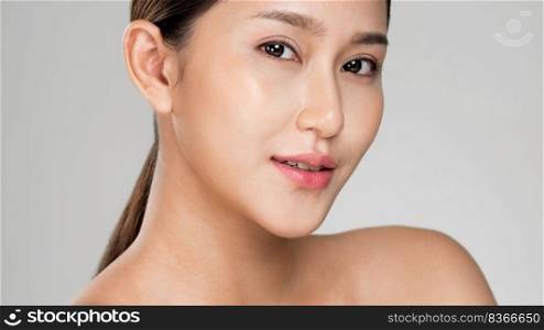 Closeup ardent young woman with healthy clear skin and soft makeup looking at camera and posing beauty gesture. Cosmetology skincare and beauty concept.. Closeup ardent young woman posing beauty gesture with clean fresh skin.