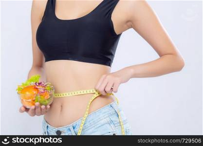 Closeup asian woman holding salad vegetable food and measuring waist for weight isolated on white background, girl diet with cellulite loss with tape measure, health care or wellness concept.