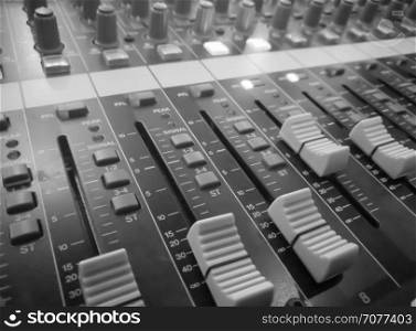 Closeup audio mixer, music equipment, monochrome picture