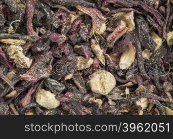 closeup background of a blood circulation and metabolism herbal tea including hibiscus and ginger