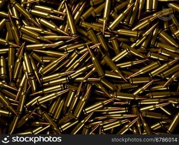 Closeup background of pile of polished rifle bullets
