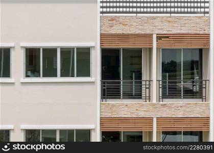 Closeup balconies and windows of apartment building.