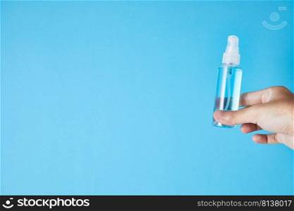 Closeup bottle of blue alcohol hand spray. corona virus concept . Closeup bottle of blue alcohol hand spray.