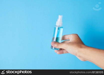 Closeup bottle of blue alcohol hand spray. corona virus concept . Closeup bottle of blue alcohol hand spray.