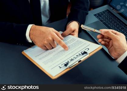 Closeup business deal meeting, businessman carefully reviewing terms and condition of contract agreement papers in office. Corporate lawyer give consultation on contract deal. Fervent. Business deal meeting, businessman reviewing terms and condition. Fervent