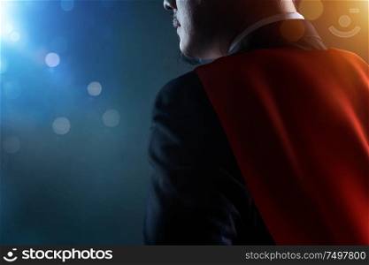 Closeup Businessman in suit and cape hero . bokeh and light flare effect apply .