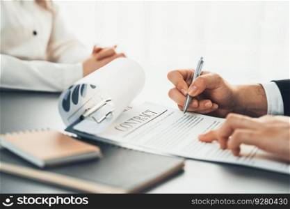 Closeup businessman sign contract or legal document with pen in his hand during corporate meeting for business deal or legal executive decision to pay off a loan or filing for bankruptcy. Equilibrium. Closeup businessman sign contract with a pen in his hand. Equilibrium
