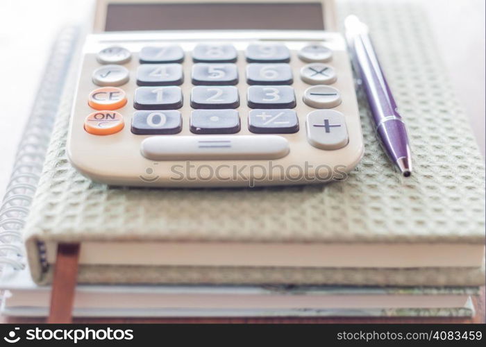 Closeup calculator, pen and notebooks, stock photo