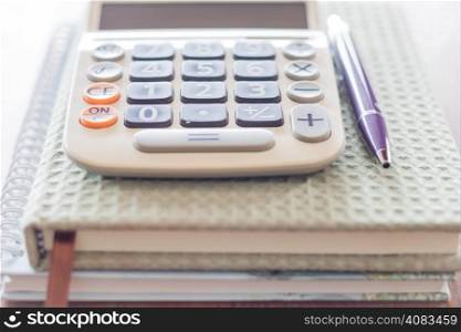 Closeup calculator, pen and notebooks, stock photo