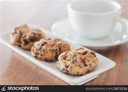 Closeup cereal cookies with coffee cup, stock photo
